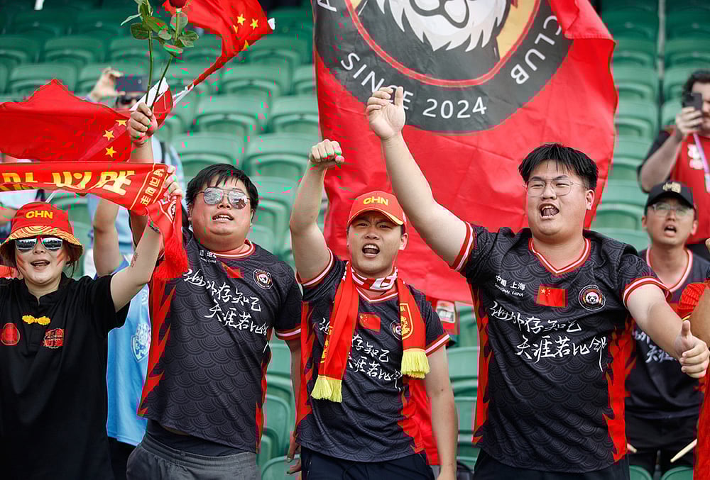 China fans react following the Women's Asian Cup quarterfinal soccer match between China and Taiwan in Perth, Australia. - | Photo: AP/Gary Day