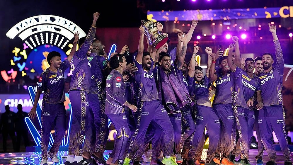 KKR players celebrate with the trophy - | Photo: AP/Mahesh Kumar A.