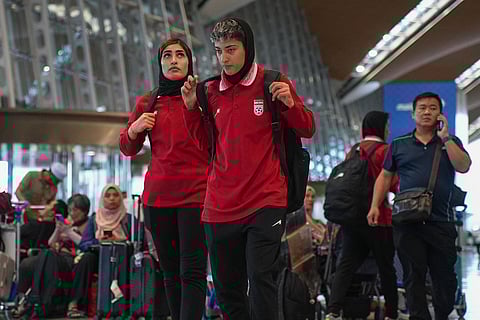 Members of Iran's women's football team arrive at the Kuala Lumpur International Airport in Sepang, Malaysia.