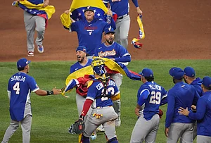 | Photo: AP/Lynne Sladk : The Venezuela team celebrates after defeating Italy at a World Baseball Classic semifinal game in Miami.