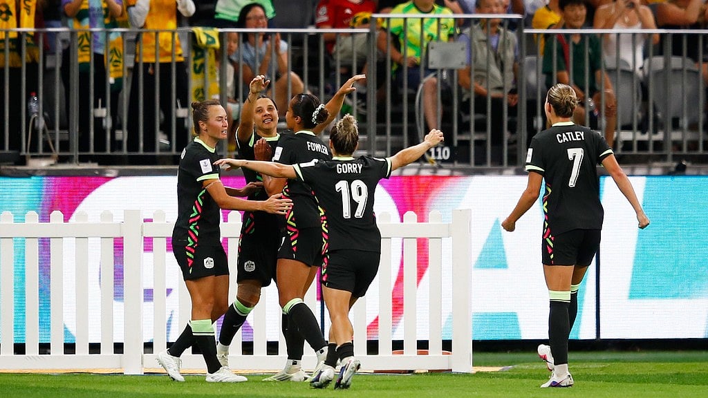 Sam Kerr, second left, is congratulated by teammates after scoring her team's second goal during the Women's Asian Cup semi-final between China and Australia in Perth, Australia. - AP