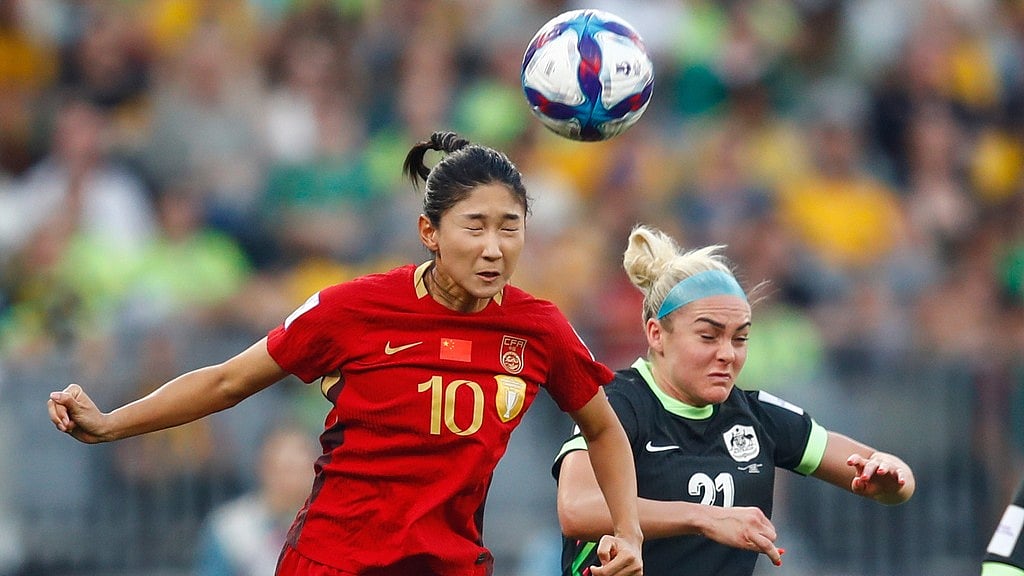 Australia's Ellie Carpenter and China's Wang Yanwen, left, compete for the ball during the Women's Asian Cup semi-final in Perth. - Photo: AP