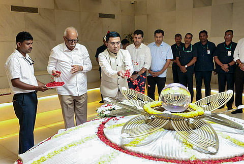 Goa Chief Minister Pramod Sawant pays floral tributes to former CM Manohar Parrikar on his death anniversary, in Miramar, Goa. 