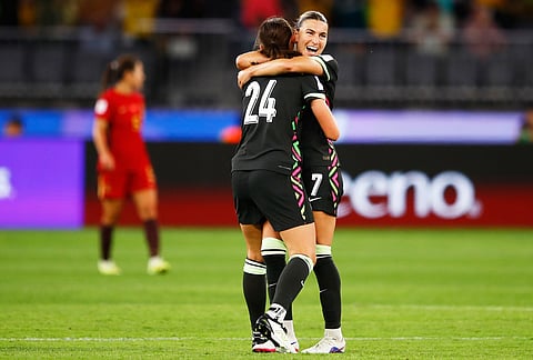 Australia's Charlize Rule, left, and teammate Steph Catley embrace following the Women's Asian Cup semifinal soccer match between China and Australia in Perth, Australia.