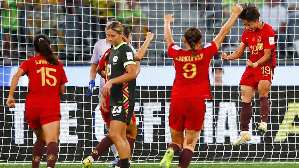 China's Zhang Linyan, right, celebrates after scoring her team's first goal from a penalty during the Women's Asian Cup semi-final between China and Australia in Perth. - Photo: AP