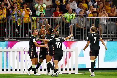 Australia's Sam Kerr, second left, is congratulated by teammates after scoring her team's second goal during the Women's Asian Cup semifinal soccer match between China and Australia in Perth, Australia.