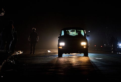 A vehicle drives down a street during a blackout in Havana, Wednesday, March 4, 2026. 