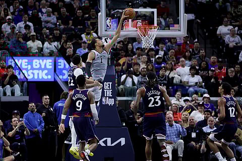 San Antonio Spurs forward Victor Wembanyama (1) dunks the ball against Los Angeles Clippers guard Jordan Miller (22), guard Bennedict Mathurin, forward Isaiah Jackson (23), and guard Cam Christie (12) during the second half of an NBA basketball game in Inglewood, Calif.