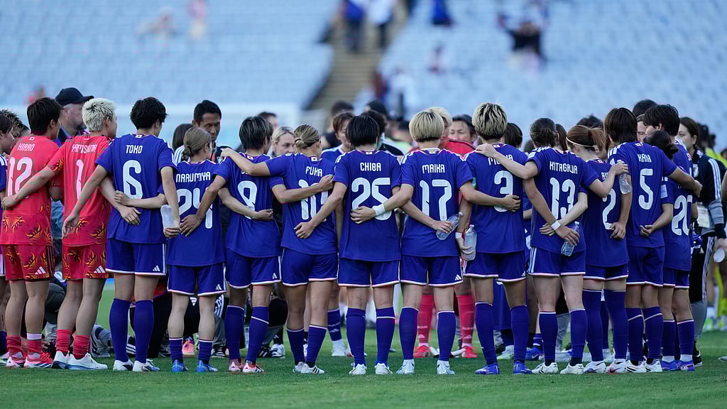 Japan players gather on the pitch following their AFC Women's Asian Cup quarter-final win over the Philippines in Sydney. - AP