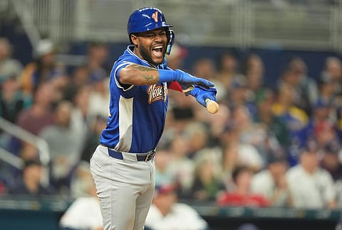 Venezuela Maikel Garcia reacts to his hit during the sixth inning in the championship game of the World Baseball Classic against the United States, in Miami. 