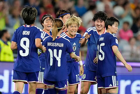 Japan's Maika Hamano, centre, is congratulated by teammates after scoring her team's second goal during the Women's Asian Cup semifinal soccer match between Japan and South Korea in Sydney.