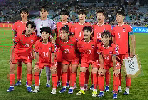South Korea pose for a team photo ahead of the Women's Asian Cup semifinal soccer match between Japan and South Korea in Sydney.