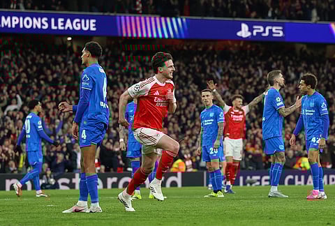 Arsenal's Declan Rice celebrates after scoring his side's second goal during the second leg of the Champions League round of 16 soccer match between Arsenal and Bayer Leverkusen, in London.