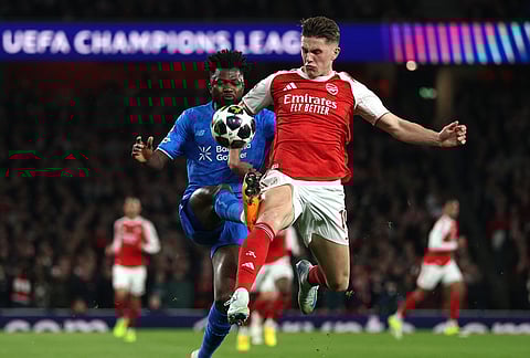 Leverkusen's Edmond Tapsoba, left, and Arsenal's Viktor Gyoekeres challenge for the ball during the second leg of the Champions League round of 16 soccer match between Arsenal and Bayer Leverkusen, in London.