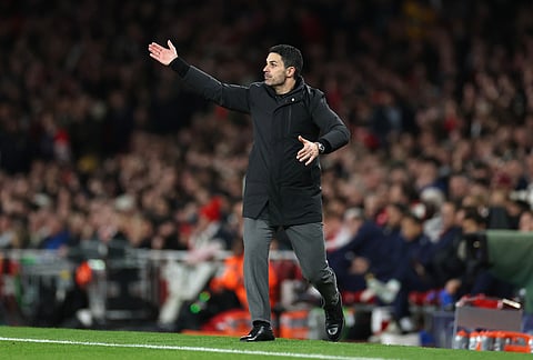 Arsenal's manager Mikel Arteta gives instructions to his players during the second leg of the Champions League round of 16 soccer match between Arsenal and Bayer Leverkusen, in London.