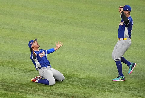 Venezuela pitcher Daniel Palencia, left, celebrates after the team defeated the United States in the championship game of the World Baseball Classic, in Miami.