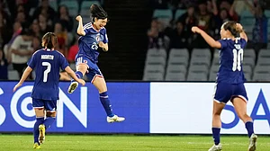 Photo: AP : Japan's Remina Chiba, centre, celebrates after scoring her team's fourth goal during the Women's Asian Cup semi-final between Japan and South Korea in Sydney.