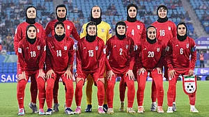 Dave Hunt/AAPImage via AP, File : Iran players pose for a team photo ahead of the Women's Asian Cup match between Iran and the Philippines in Robina, Australia.