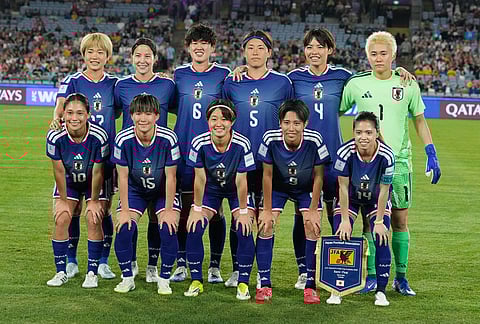 Japan pose for a team photo ahead of the Women's Asian Cup semifinal soccer match between Japan and South Korea in Sydney.