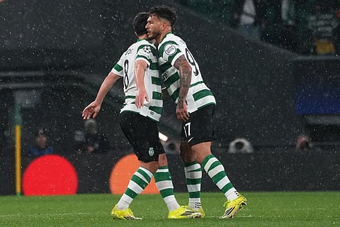 Sporting's Pedro Goncalves, left, celebrates after scoring his side's second goal during a Champions League round of 16 second leg soccer match between Sporting CP and Bodo Glimt in Lisbon, Portugal.