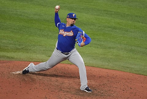 Venezuela pitcher Andrés Machado aims a pitch during the seventh inning in the championship game of the World Baseball Classic against the United States in Miami.