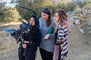 Netraa Dave filming outdoors with two other women