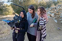 Netraa Dave filming outdoors with two other women