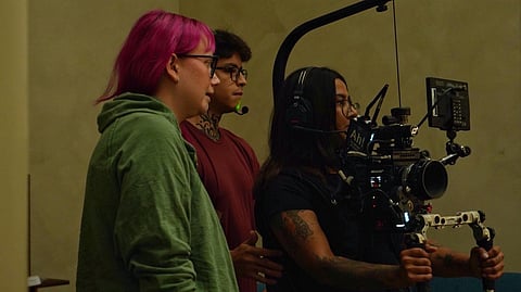 Netraa Dave operating a camera rig with her crew