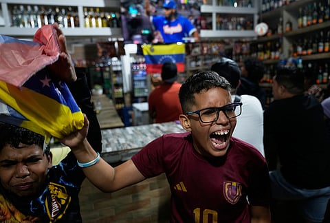 Venezuela fans watch the championship match of the World Classic Baseball between the United States and Venezuela, in Caracas, Venezuela.