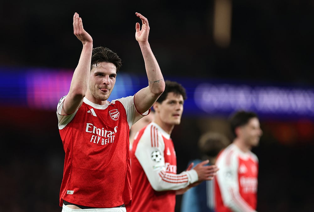 Arsenal's Declan Rice celebrates after winning the second leg of the Champions League round of 16 soccer match between Arsenal and Bayer Leverkusen, in London. - | Photo: AP/Ian Walton