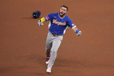 Venezuela Wilyer Abreu reacts after hitting a home run during the fifth inning in the championship game of the World Baseball Classic against the United States in Miami. 
