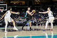 |  Photo: AP/Brandon Dill : Memphis Grizzlies guard Ty Jerome (2) handles the ball between Denver Nuggets guards Jamal Murray (27) and Christian Braun (0) in the second half of an NBA basketball game in Memphis, Tennessee.