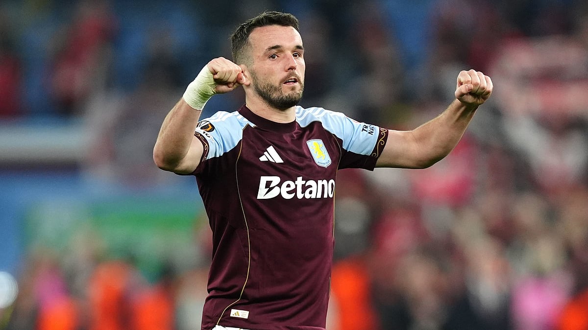 Aston Villa's John McGinn celebrates the win after the Europa League round of sixteen second leg soccer match between Aston Villa and LOSC Lille in Birmingham. - David Davies/PA via AP