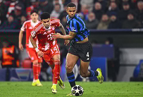 Bayern Munich's Luis Díaz and Atalanta Bergamo's Isak Hien fight for the ball in Munich, Germany. 