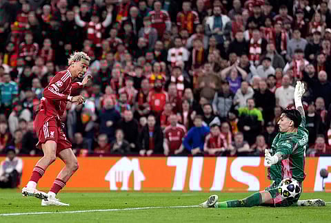 Liverpool's Hugo Ekitike scores his side's second goal during the second leg of the Champions League round of 16 soccer match between Liverpool and Galatasaray, in Liverpool, England.