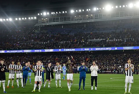 Newcastle players applaud the fans of their team after the Champions League round of 16, second leg soccer match between FC Barcelona and Newcastle United FC in Barcelona, Spain.