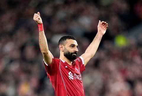 Liverpool's Mohamed Salah celebrates scoring his side's fourth goal  during the second leg of the Champions League round of 16 soccer match between Liverpool and Galatasaray, in Liverpool, England.