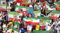 Can Iran's FIFA World Cup 2026 Games At USA Be Shifted To Mexico? What We Know So Far AP : Iran supporters wave flags and hold images of Reza Pahlavi, the son of the last Shah of Iran, during the Women's Asian Cup match between Iran and the Philippines in Robina.