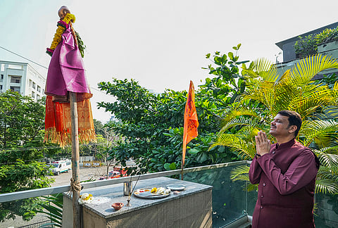 Maharashtra Chief Minister Devendra Fadnavis offers prayers during celebrations of the 'Gudhi Padwa' festival, in Nagpur. 