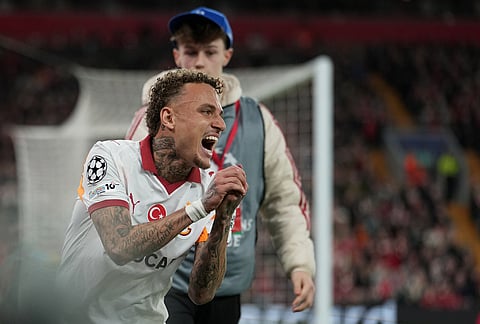 Galatasaray's Noa Lang reacts after sustaining an injury during the second leg of the Champions League round of 16 soccer match between Liverpool and Galatasaray, in Liverpool, England.