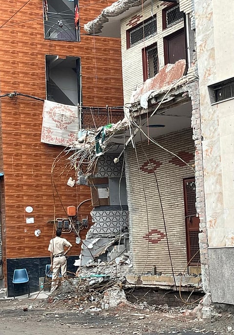 The home of the Muslim family now stands abandoned and partially demolished, cordoned off and surrounded by a heavy police presence.