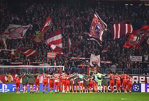 Bayern Munich players thank the fans after their match against Atalanta Bergamo, in Munich, Germany. 
