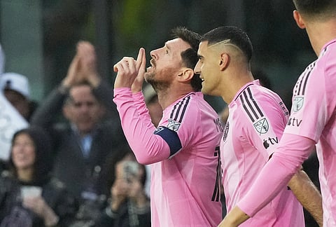 Inter Miami forward Lionel Messi gestures after scoring his 900th goal during a CONCACAF Champions Cup Round of 16 soccer match against Nashville, in Fort Lauderdale, Florida.