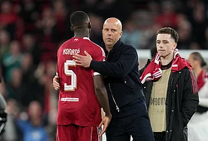| Photo: AP/Jon Super : Liverpool's manager Arne Slot, center, celebrates with Liverpool's Ibrahima Konate at the end of the second leg of the Champions League round of 16 soccer match between Liverpool and Galatasaray, in Liverpool, England.