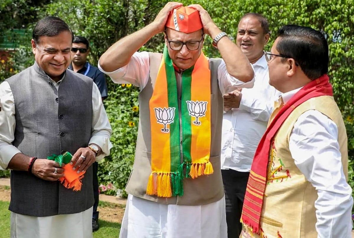 On March 18, Assam Chief Minister Himanta Biswa Sarma, left, and BJP Assam president Dilip Saikia, right, welcome Nagaon MP Pradyut Bordoloi into the Bharatiya Janata Party, in New Delhi.  - PTI