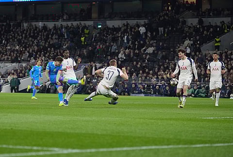 Atletico Madrid's Julian Alvarez, second from left, scores his side's first goal during the Champions League round of 16, second leg soccer match between Tottenham and Atletico Madrid in London, England.