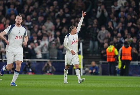 Tottenham's Xavi Simons, centre, celebrates after scoring his side's second goal during the Champions League round of 16, second leg soccer match between Tottenham and Atletico Madrid in London, England.