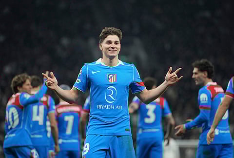 Atletico Madrid's Julian Alvarez celebrares after scoring his side's first goal during the Champions League round of 16, second leg soccer match between Tottenham and Atletico Madrid in London, England.