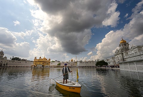 Dark clouds hover over the Golden Temple, in Amritsar.