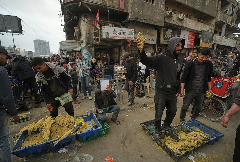 Eid al-Fitr 2026 in Gaza-Palestinians shop at a market 